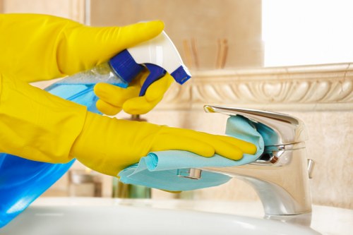 Staff member wearing PPE during professional carpet cleaning in Clerkenwell